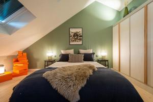 En eller flere senge i et værelse på Sublime duplex 100m2 Villa classée