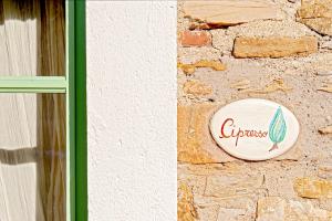 Certificato, attestato, insegna o altro documento esposto da Podere La Gualda Vecchia alloggi di charme immersi nel Giardino Emozionale outdoor SPA