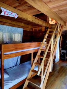 a pair of bunk beds in a cabin at CHALET RONDIN JURA in Aromas