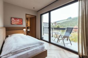 Postel nebo postele na pokoji v ubytování Hilburger Hotel + 37 fotografií