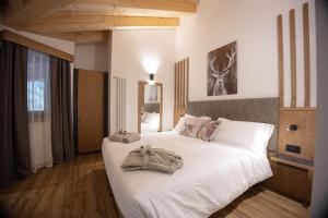 Postel nebo postele na pokoji v ubytování Hotel Villa Melì