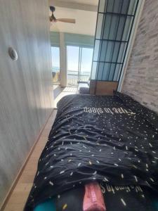 Cama ou camas em um quarto em Vue mer exceptionnelle