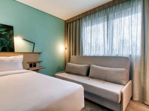 Cama ou camas em um quarto em Novotel BH Savassi