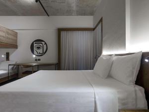 Postel nebo postele na pokoji v ubytování ibis Styles Maceió Pajuçara