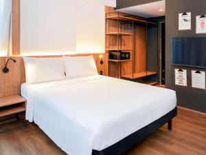 Postel nebo postele na pokoji v ubytování ibis Styles Maceió Pajuçara