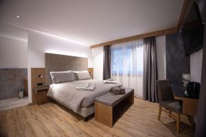 Postel nebo postele na pokoji v ubytování Hotel Villa Melì