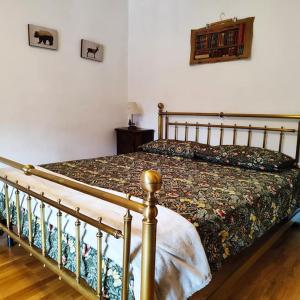 a bedroom with a bed with a wooden frame at Bardo Escape in Bardonecchia