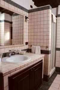 a bathroom with a sink and a mirror at Il Borgo Della Marinella in Amantea