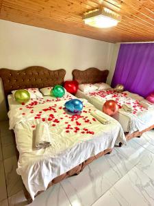 a bedroom with two beds with balloons on them at HOTEL RAYDON in Istanbul