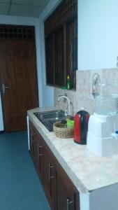 a kitchen with a sink and a counter top at Rock house kurunegala in Kurunegala