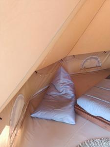 a tent with two beds inside of it at Lainkalogos glamping in Rabia