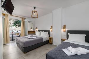 Postel nebo postele na pokoji v ubytování Marianna Hotel + 37 fotografií