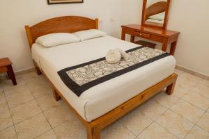 Postel nebo postele na pokoji v ubytování Hotel Las Palmas Cancun Centro