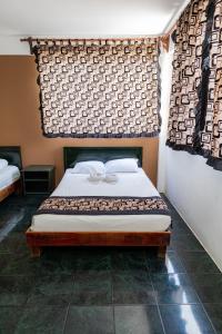 Postel nebo postele na pokoji v ubytování Hotel Las Palmas Cancun Centro