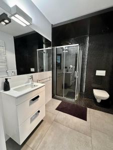 Kúpeľňa v ubytovaní LuxApart Kalisz