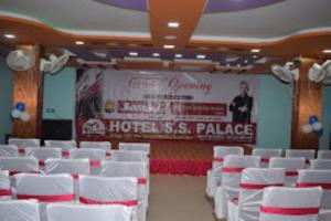 a room with white chairs and a large banner at Hotel S.S.Palace Samastipur, Samastipur in Samastīpur