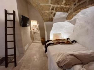 Krevet ili kreveti u jedinici u objektu La Segreta del Castello Self Check-in, private access