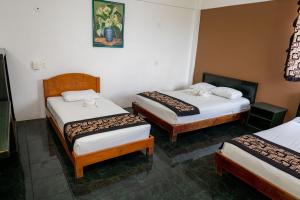 Postel nebo postele na pokoji v ubytování Hotel Las Palmas Cancun Centro