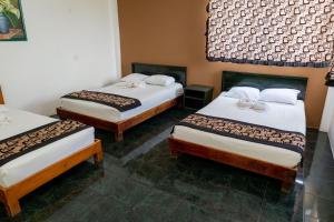 Postel nebo postele na pokoji v ubytování Hotel Las Palmas Cancun Centro