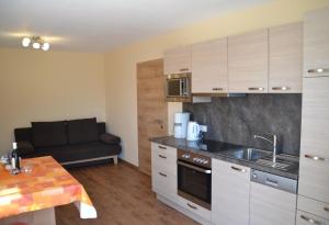 Kuchyň nebo kuchyňský kout v ubytování Appartements Real