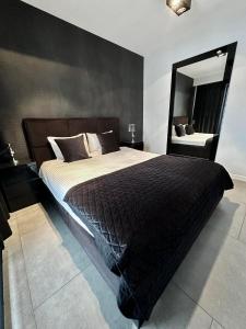 Posteľ alebo postele v izbe v ubytovaní LuxApart Kalisz