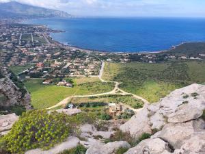 an aerial view of a village on a hill next to the ocean at Casa vacanze Poma in Custonaci +10 photos