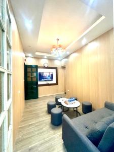 a living room with a couch and a table at Kolor Home/2Brs/Near Hoankiem Lake/Old Quarter in Hanoi