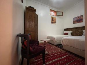 Postel nebo postele na pokoji v ubytování Riad ouhmidi