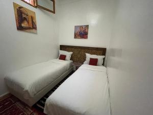 Postel nebo postele na pokoji v ubytování Riad ouhmidi