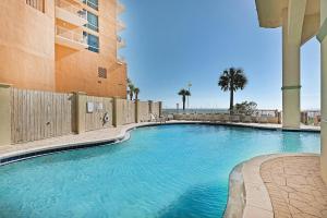 a swimming pool in front of a building at Celadon 302 in Panama City Beach