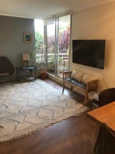 TV a/nebo společenská místnost v ubytování Apartamento Full