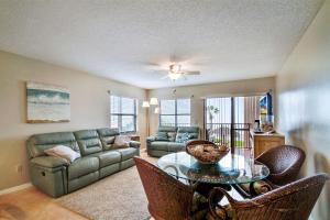 a living room with a couch and a table at Emerald Isle 101 in St Pete Beach