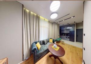 a living room with a couch and a table at Seabreeze, Lighthouse, Baku, Azerbaijan in Baku