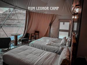 a room with two beds in a tent at RUM LEONOR CAMP in Wadi Rum