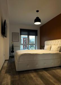 Ένα ή περισσότερα κρεβάτια σε δωμάτιο στο Skylark - Lisbon Condo with Panoramic View Terrace