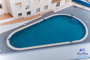 an overhead view of a large swimming pool in a building at Breakfast at Tiffanys in La Herradura