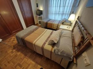 Postel nebo postele na pokoji v ubytování apartamento gran Vía