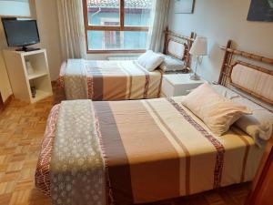 Postel nebo postele na pokoji v ubytování apartamento gran Vía