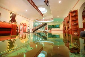 a large room with a glass floor in a building at Wisdom Boutique Resort in Kandy