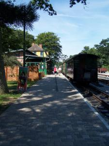 a train station with people walking on the platform at Appartement Granitz - Ferienwohnung Thoenissen in Göhren