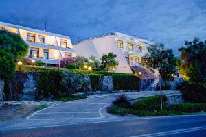 a building on a street next to a building at Hippocampus Hotel in Naousa