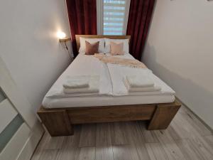Posteľ alebo postele v izbe v ubytovaní Apartament w Śródmieściu