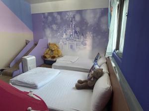 We Smile B&B tesisinde bir odada yatak veya yataklar