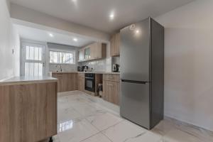 Η κουζίνα ή μικρή κουζίνα στο Sant Central Deluxe Apartments