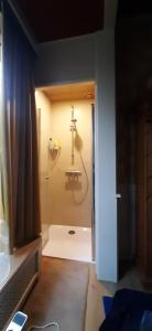 a bathroom with a shower with a glass door at B & B De Groene Slaper in Silvolde