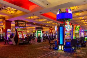 a casino with many slot machines in a room at Red Hawk Resort & Casino in Placerville