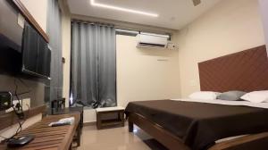 Μια τηλεόραση ή/και κέντρο ψυχαγωγίας στο HOTEL COASTAL INN