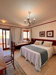 Postel nebo postele na pokoji v ubytování Hotel Vila Nova do Príncipe