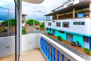 a balcony with a view of a street at Apartment in San Cristóbal with 2 Bedrooms, 6 Beds, Living Room, Dining Room, Kitchen, Private Balcony, Terrace with Ocean View, Washer, Satellite Internet, Near Bars and Restaurants - Blue Horizon - Galápagos Home in Puerto Baquerizo Moreno