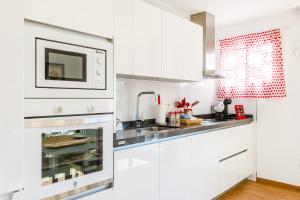 Kuchyň nebo kuchyňský kout v ubytování Apartamento IRMASOL